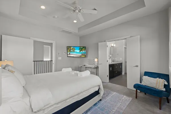 a bedroom with a bed and a couch