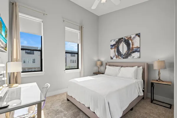 a bedroom with a bed and a chair