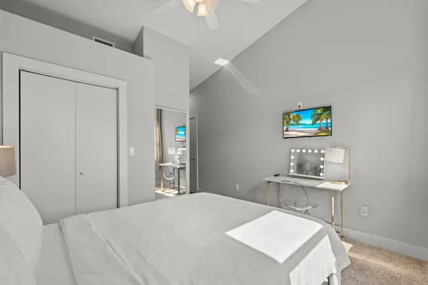 a bedroom with a bed and a table in it