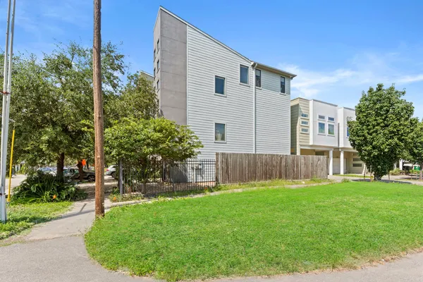 a view of house with backyard