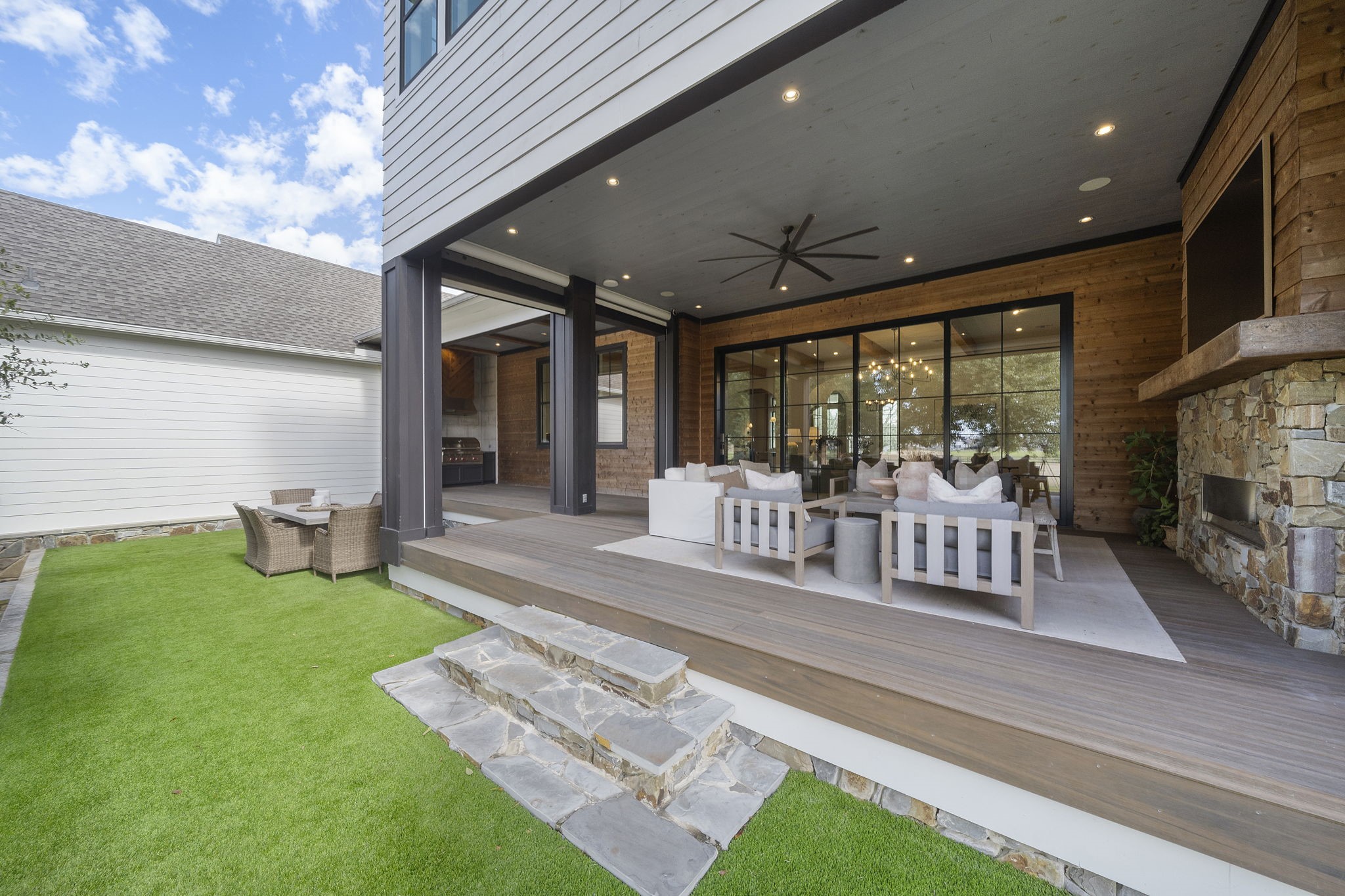 5511 Fulbrook Road Fulshear, TX 77441 - Photo 49 of 50 Outdoor living at its finest! A 60" Linear Outdoor Heatilator with multicolored LED lighting and remote-controlled roll down shades to enjoy the outdoors while watching your favorite sports or hosting events!
