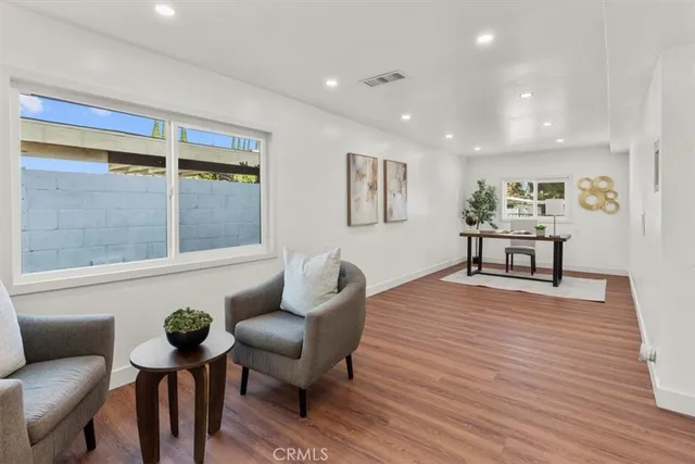 a workspace with furniture and wooden floor