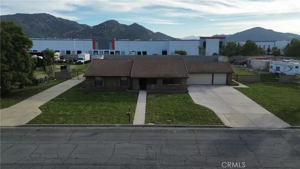 a view of house with outdoor space and river