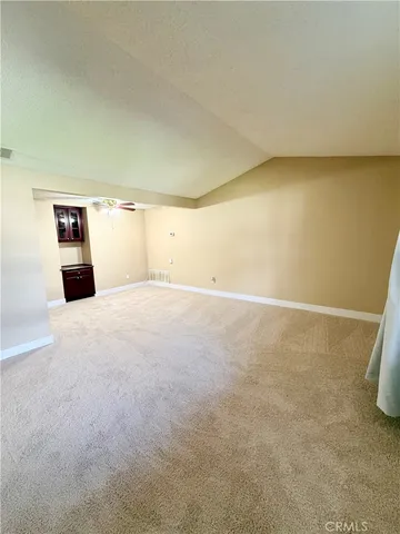 a large kitchen with a stove a sink dishwasher and a refrigerator