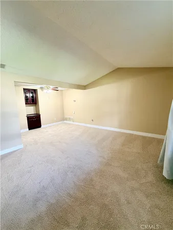 a large kitchen with a stove a sink dishwasher and a refrigerator