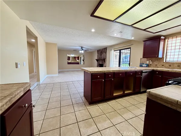 a kitchen with stainless steel appliances granite countertop a stove and a sink