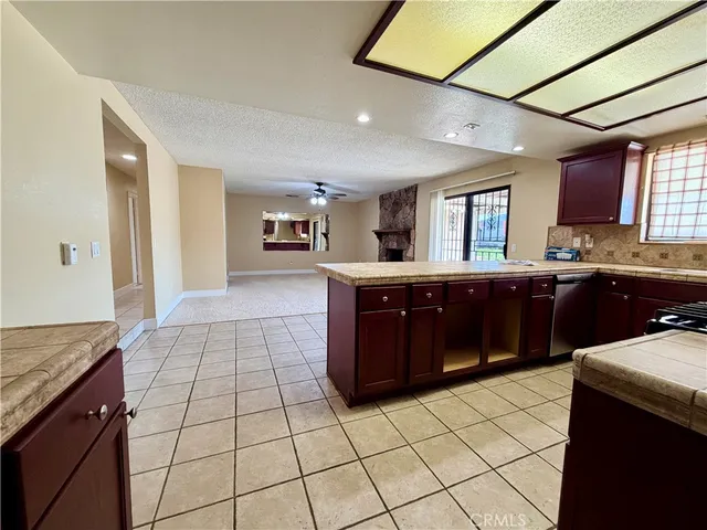 a kitchen with stainless steel appliances granite countertop a stove and a sink