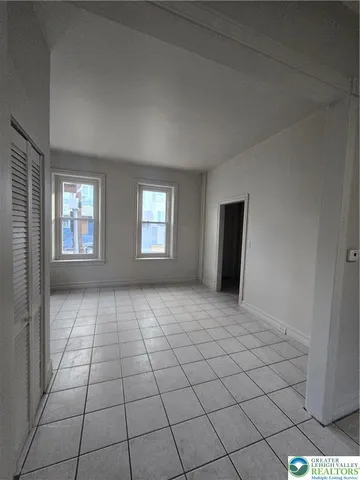 a view of an empty room and window