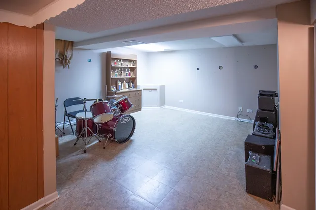 a living room with furniture and a chair