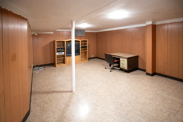 a view of a livingroom with furniture and natural light