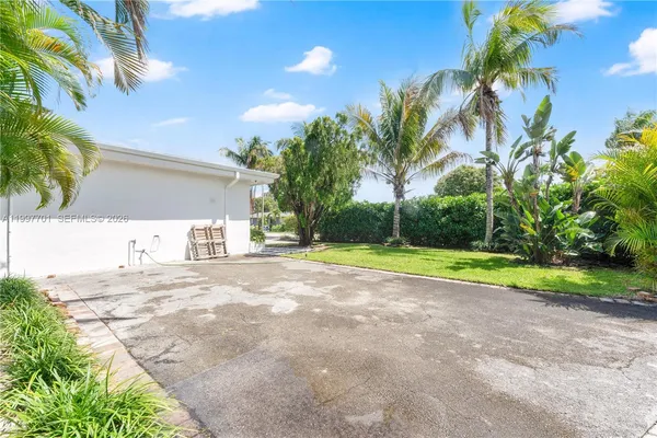 a view of backyard of a house