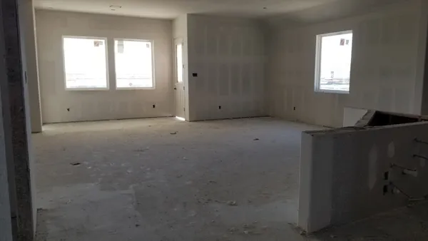 an empty room with windows