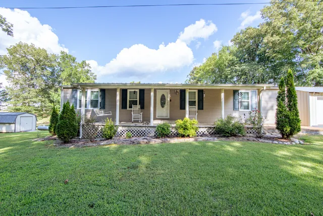 front view of a house with a yard