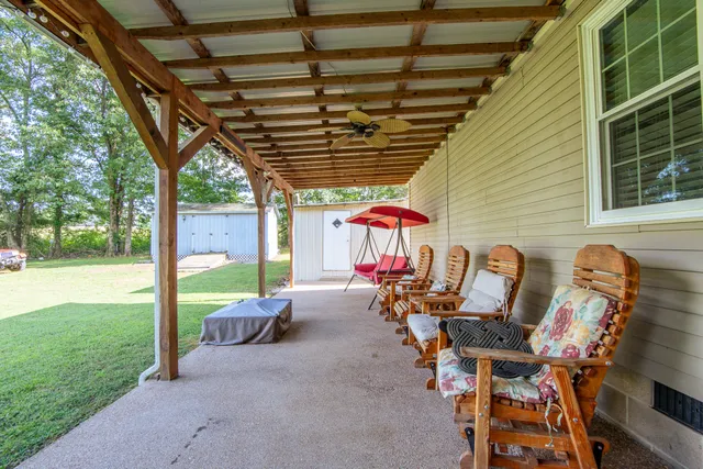 a kitchen with granite countertop stainless steel appliances a refrigerator stove top oven and sink