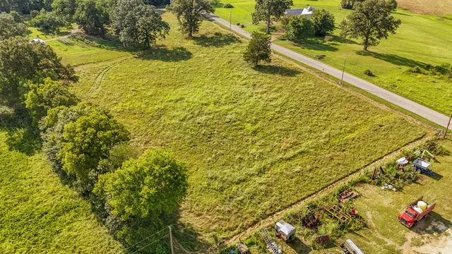 a kitchen with stainless steel appliances granite countertop a refrigerator a stove and a sink