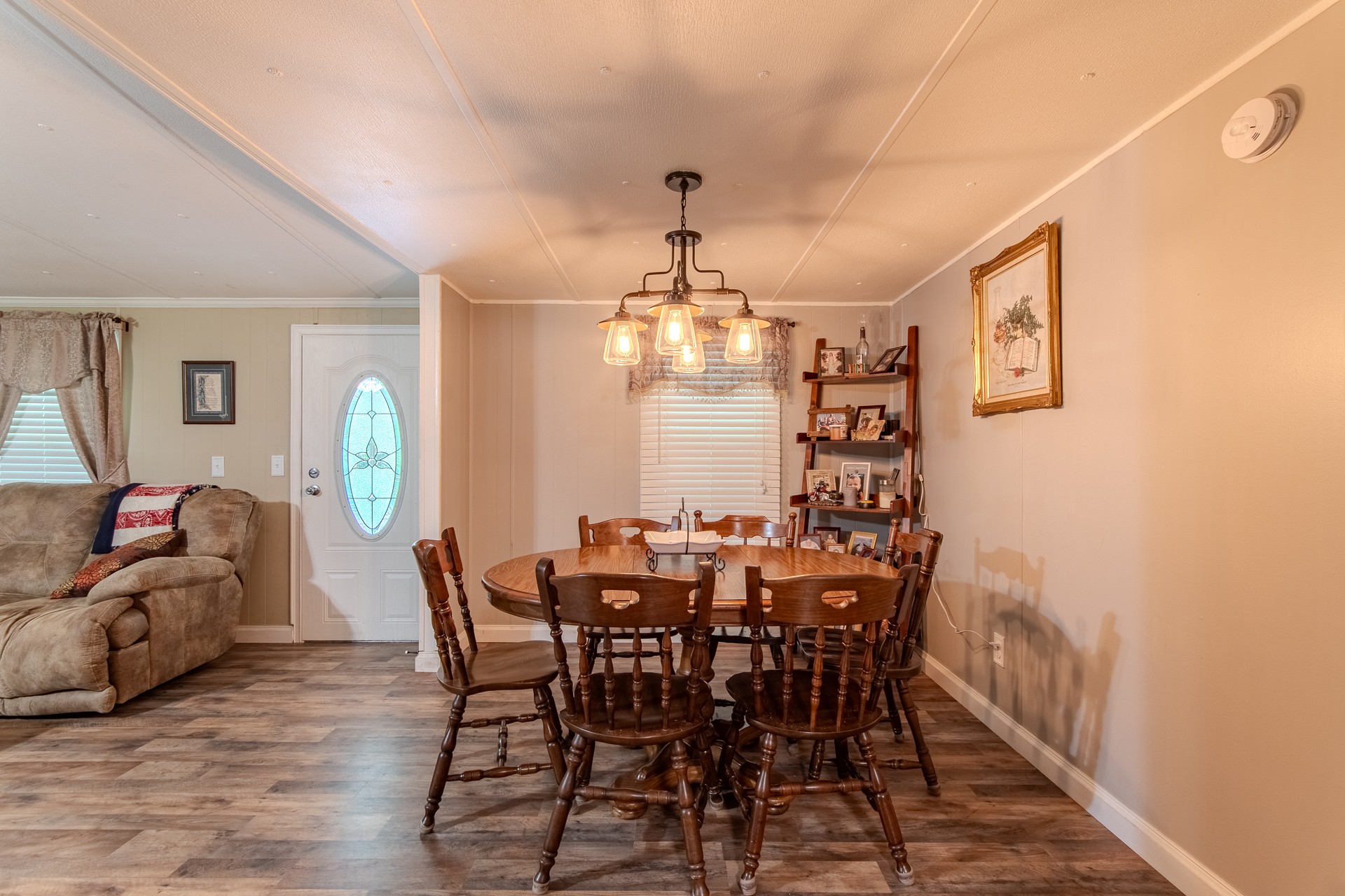 3130 Nance Bend Road Clifton, TN 38425 - Photo 27 of 76 a view of a dining room with furniture and chandelier