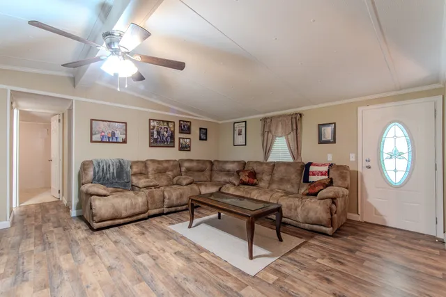 a room with furniture and a flat screen tv