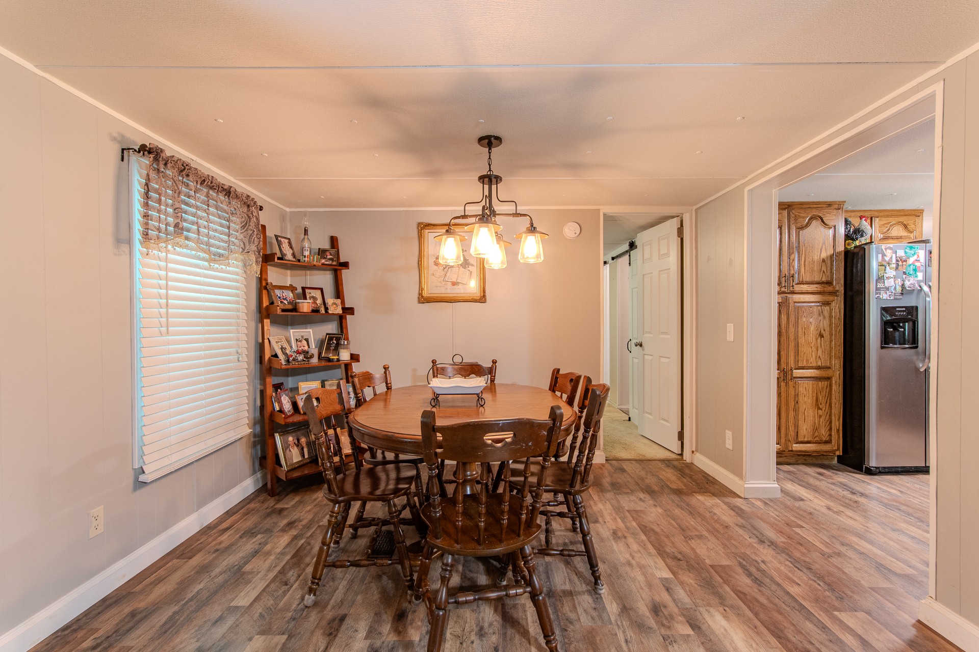 3130 Nance Bend Road Clifton, TN 38425 - Photo 32 of 76 a view of a dining room with furniture and wooden floor