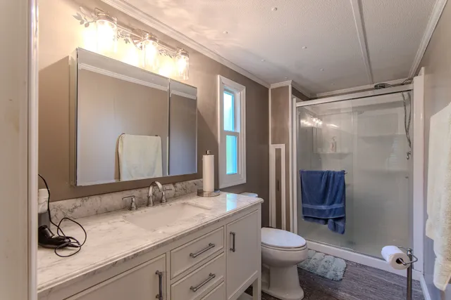 a backyard of a house with yard table and chairs