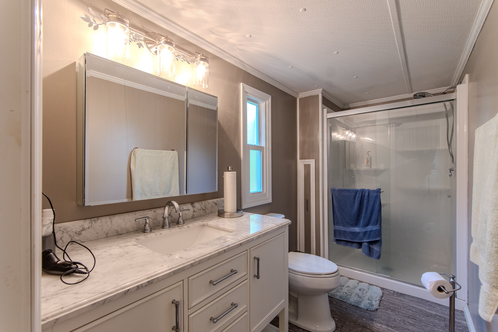 3130 Nance Bend Road Clifton, TN 38425 - Photo 37 of 76 a bathroom with a granite countertop sink toilet and shower