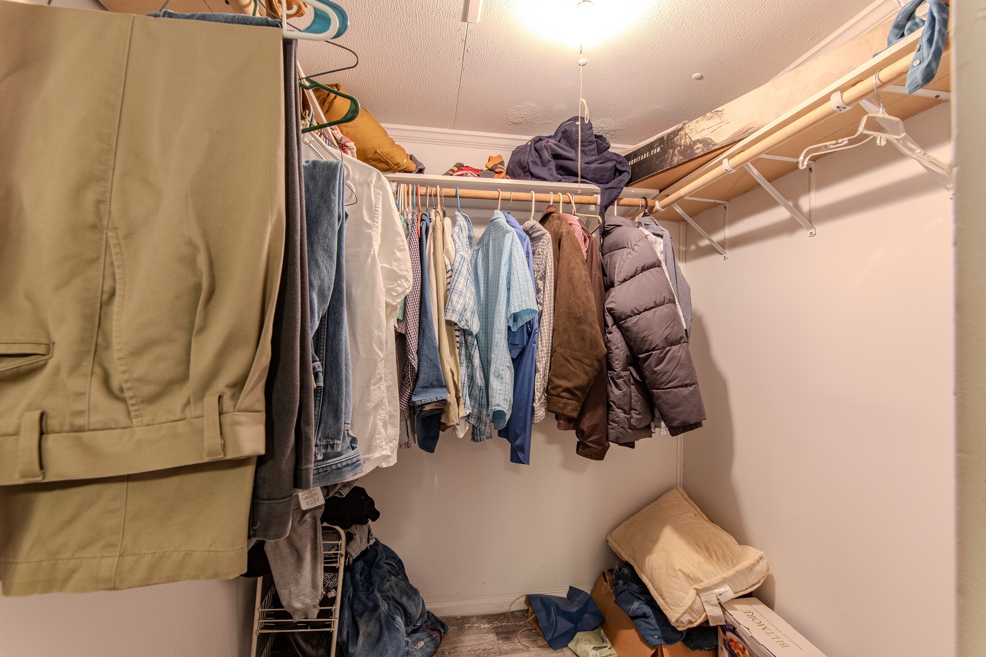 3130 Nance Bend Road Clifton, TN 38425 - Photo 38 of 76 a view of walk in closet with clothes and shoes
