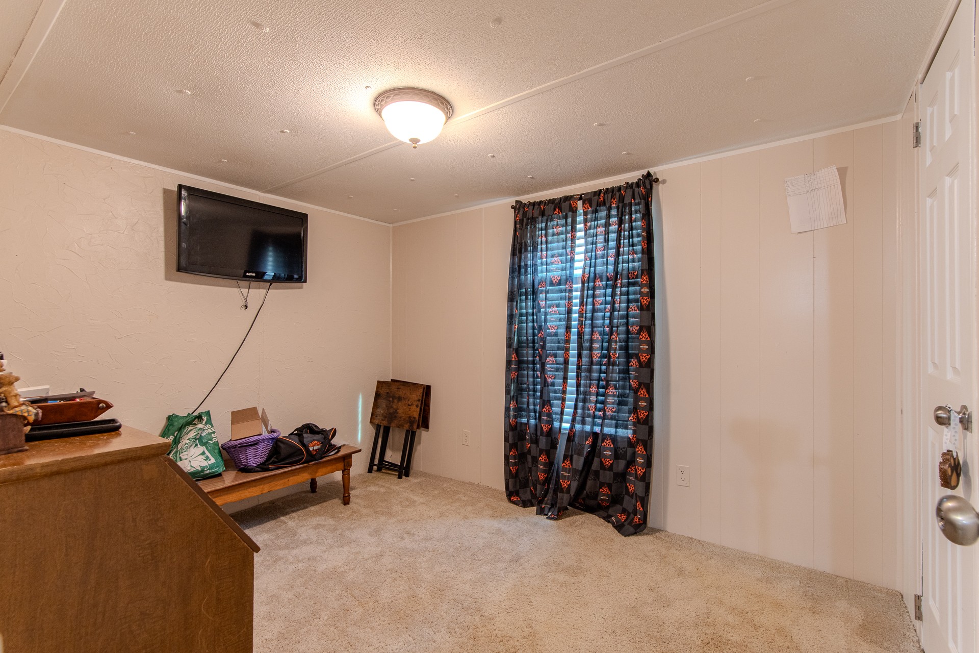 3130 Nance Bend Road Clifton, TN 38425 - Photo 42 of 76 a room with furniture and a flat screen tv