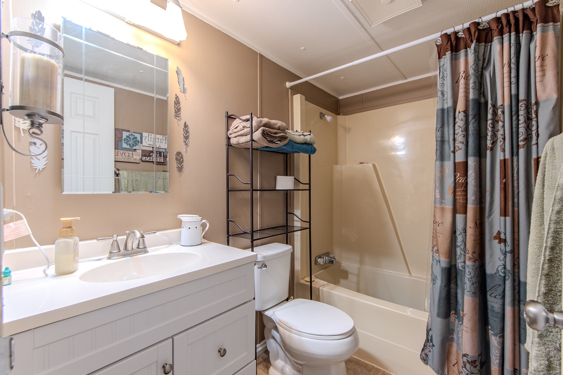 3130 Nance Bend Road Clifton, TN 38425 - Photo 43 of 76 a bathroom with a sink a toilet a mirror and shower