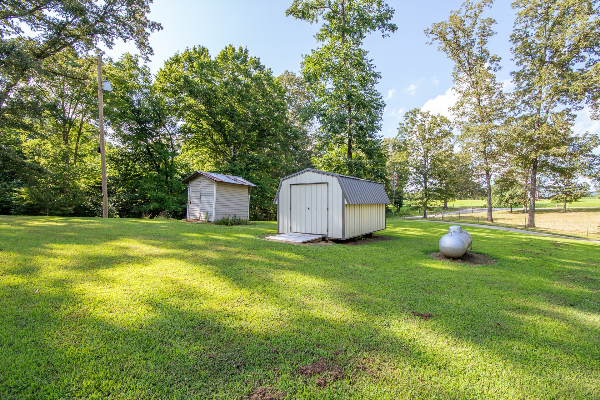 3130 Nance Bend Road Clifton, TN 38425 - Photo 9 of 76 a view of a house with backyard and garden