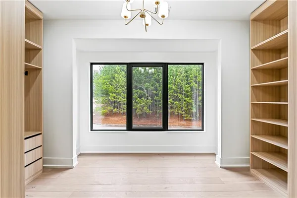 a view of a hallway with closet