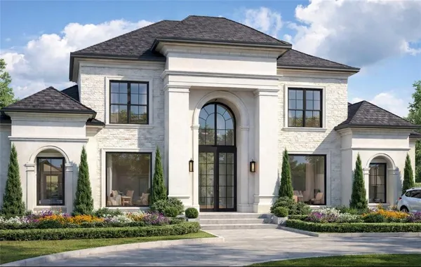 a front view of a house with garden