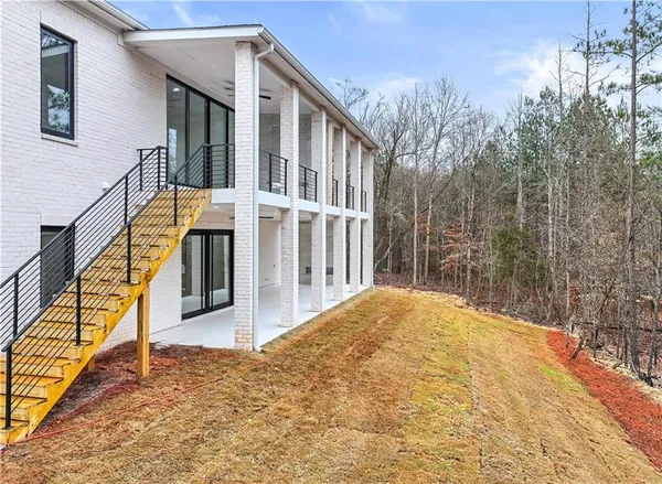 an aerial view of house with yard