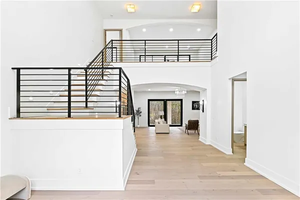 a large kitchen with stainless steel appliances kitchen island granite countertop a refrigerator and a stove top oven