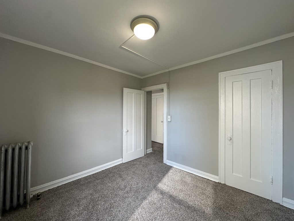 661 West Sheridan Road, Unit 601 Chicago, IL 60613 - Photo 16 of 20 an empty room with a fan & a window