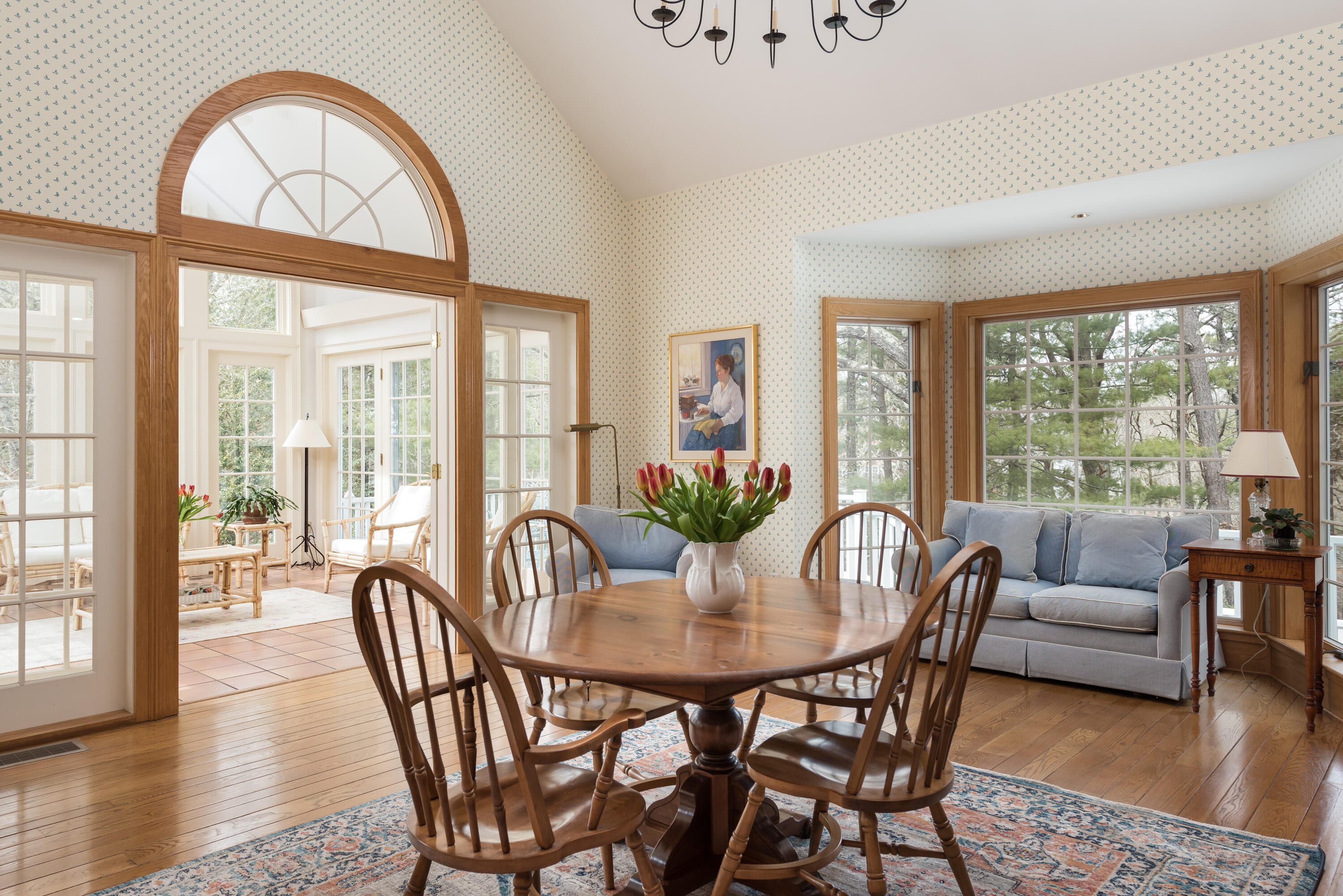 100 Ice Valley Road Osterville, MA 02655 - Photo 11 of 22 a view of a dining room with furniture wooden floor and a potted plant