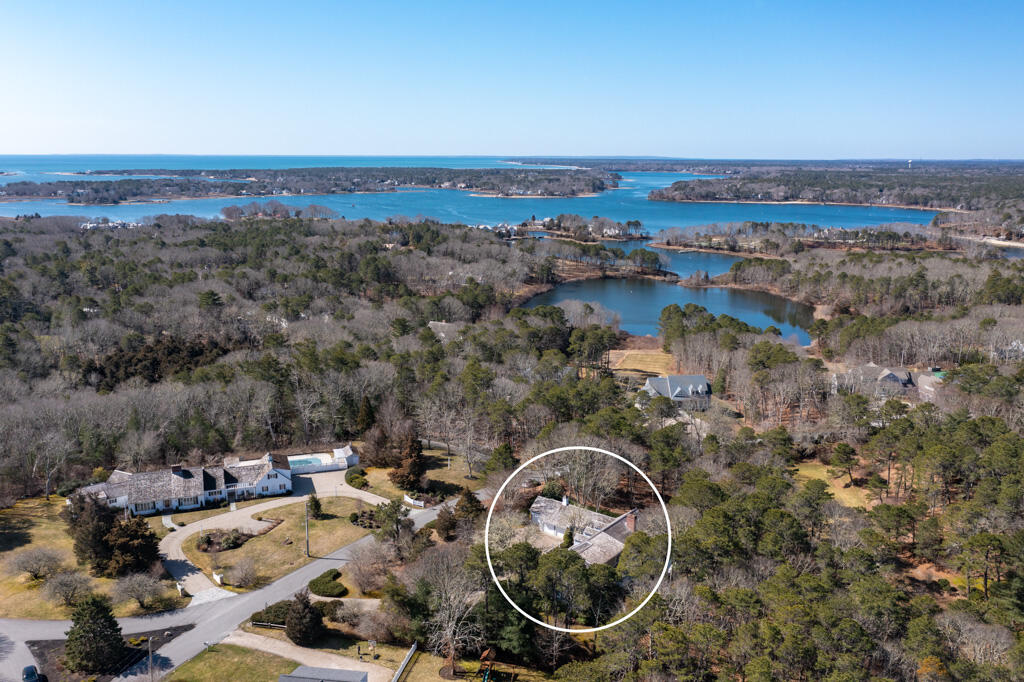 100 Ice Valley Road Osterville, MA 02655 - Photo 2 of 22 an aerial view of a house with a garden