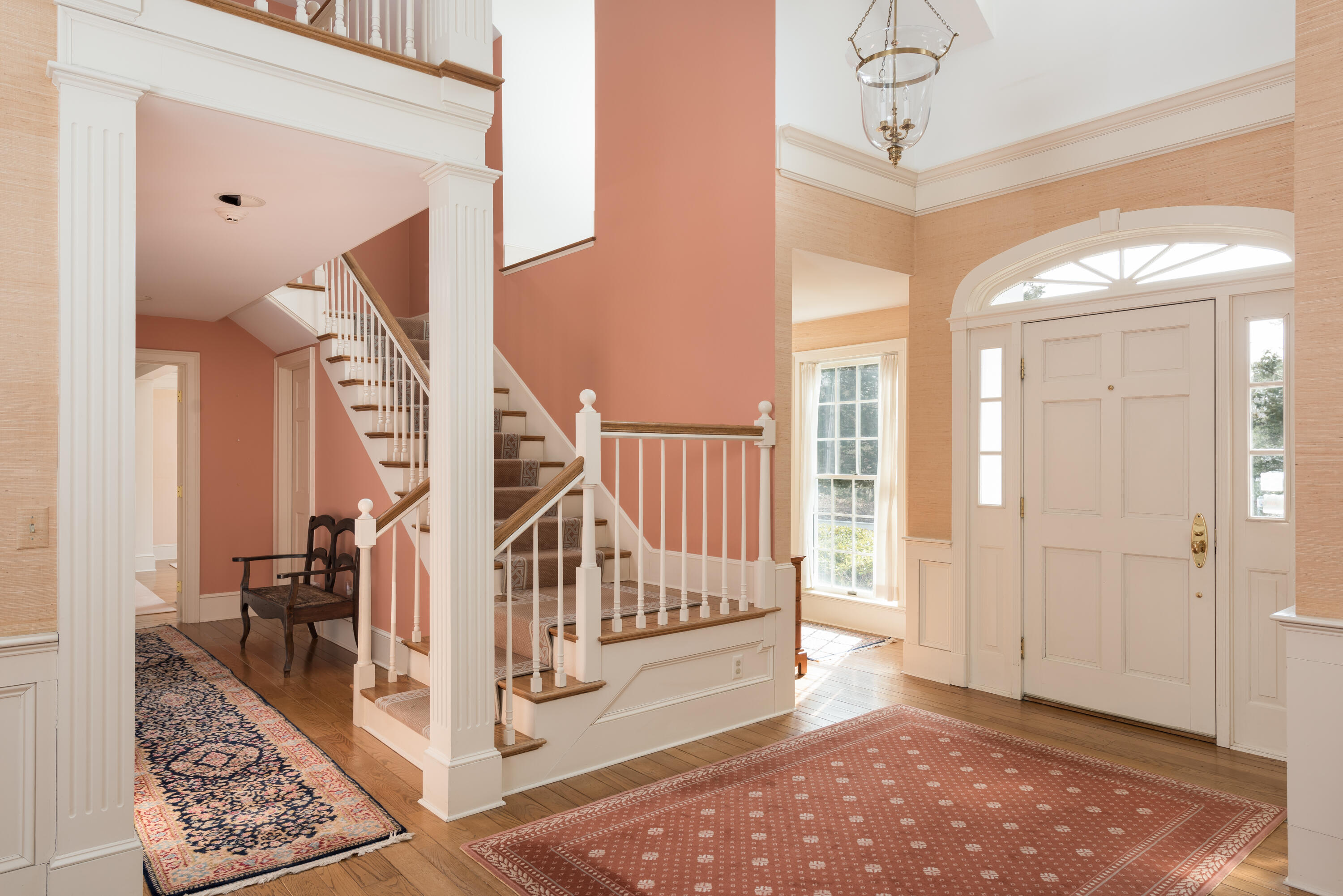 100 Ice Valley Road Osterville, MA 02655 - Photo 4 of 22 a view of entryway with wooden floor and stairs