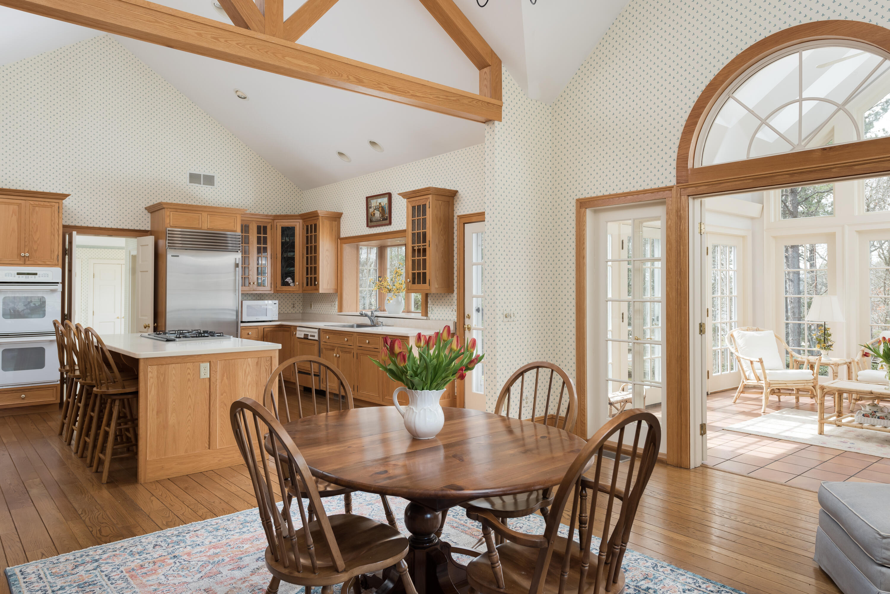 100 Ice Valley Road Osterville, MA 02655 - Photo 7 of 22 a view of a dining room with furniture window and wooden floor