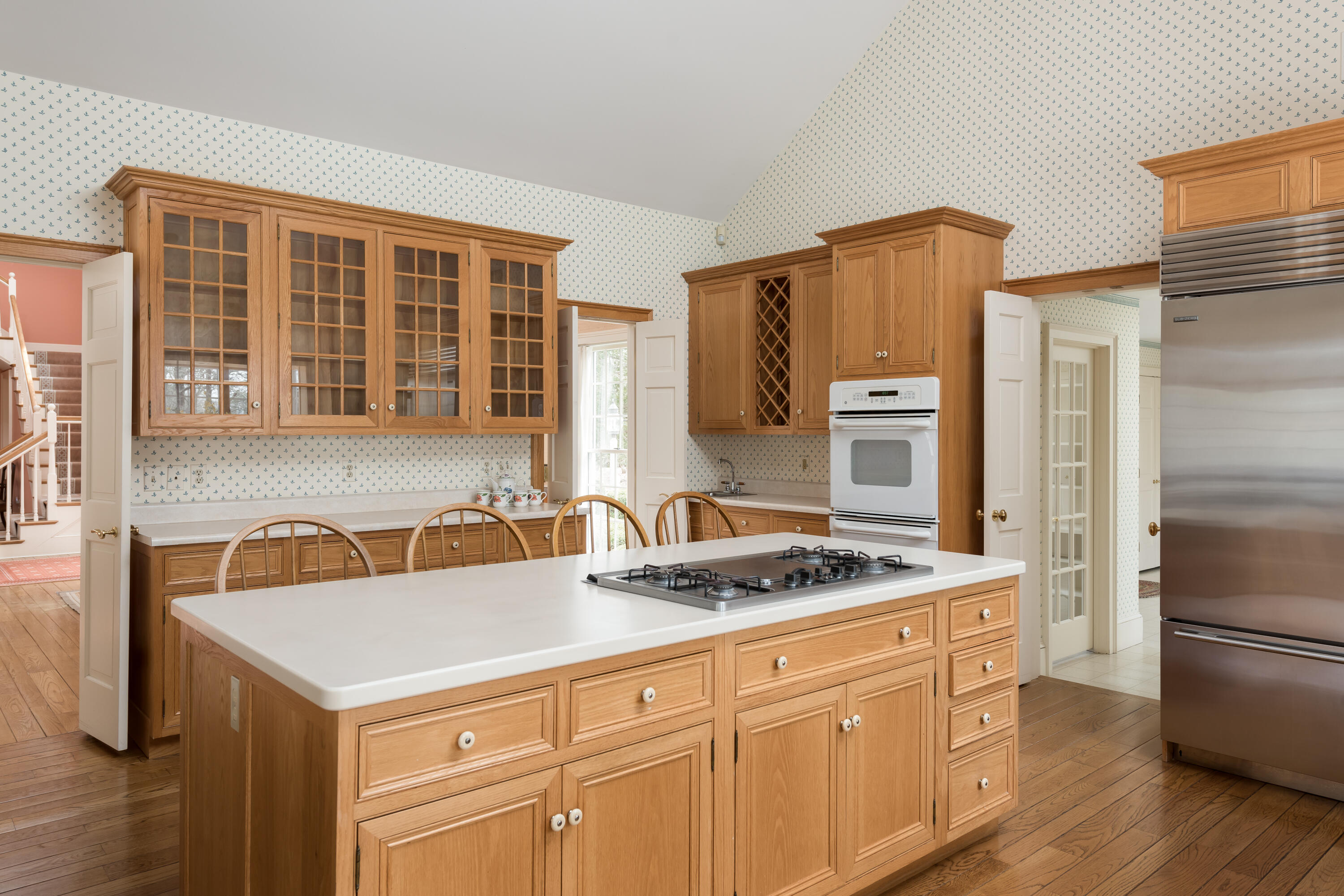 100 Ice Valley Road Osterville, MA 02655 - Photo 8 of 22 a kitchen with stainless steel appliances granite countertop a refrigerator a stove and a sink with wooden floors