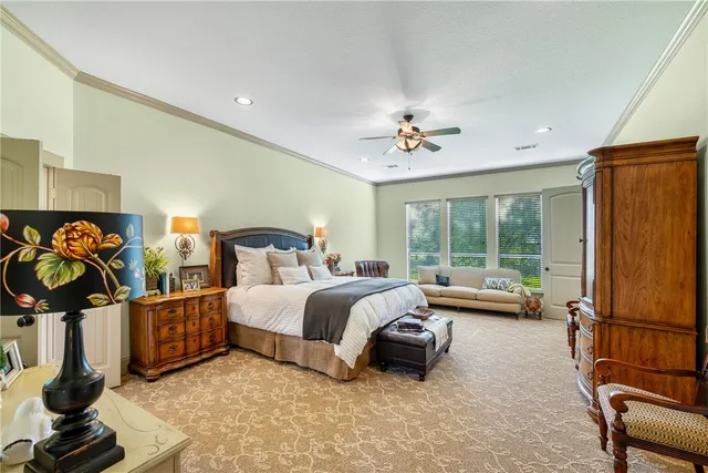 a room with furniture and view of kitchen