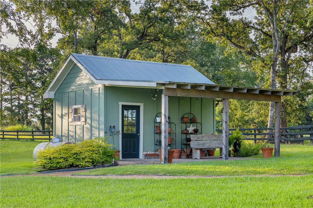 5107 Bovista Ranch Road Navasota, TX 77868 - Photo 15 of 50 a view of a house with a backyard porch and sitting area