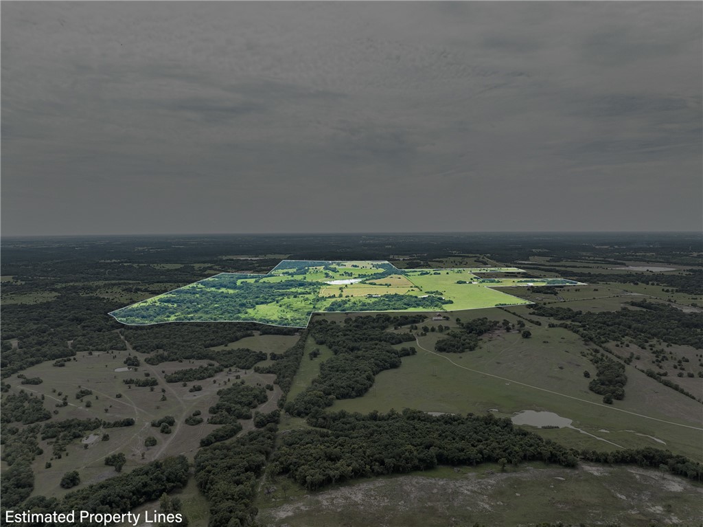 5107 Bovista Ranch Road Navasota, TX 77868 - Photo 33 of 50 a view of a lake with a yard