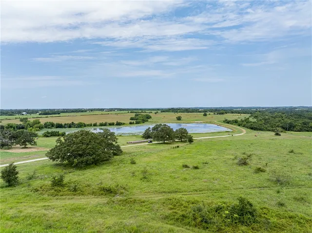 a view of a lake with houses in the background