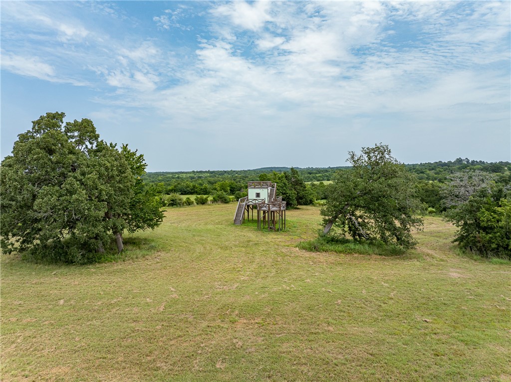 5107 Bovista Ranch Road Navasota, TX 77868 - Photo 38 of 50 a view of a lake with houses in the background