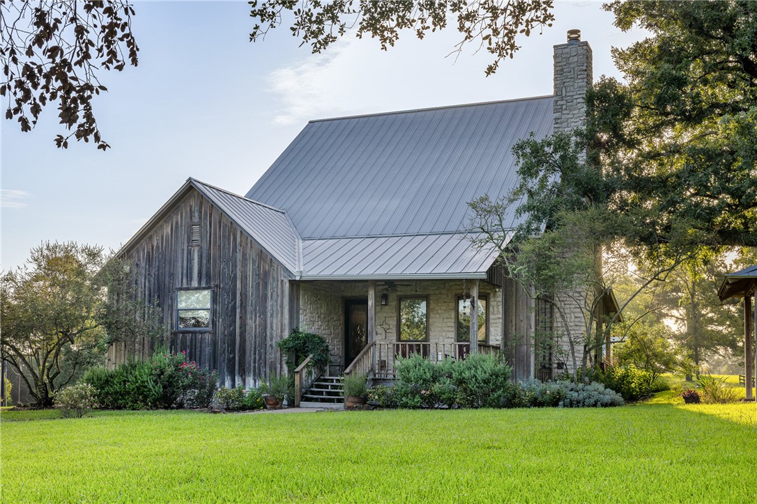 5107 Bovista Ranch Road Navasota, TX 77868 - Photo 4 of 50 a front view of a house with a yard and trees