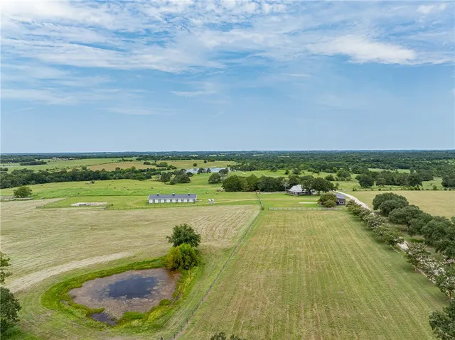 a view of a lake with a yard