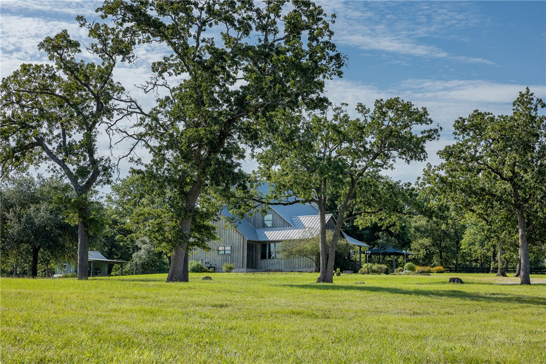 5107 Bovista Ranch Road Navasota, TX 77868 - Photo 5 of 50 a front view of a house with a yard