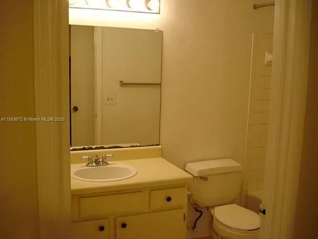 a bathroom with a sink and a toilet
