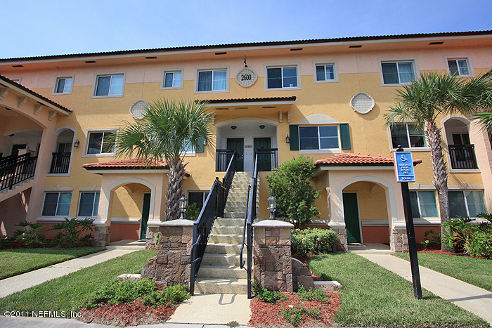 9745 Touchton Road, Unit 2625 Jacksonville, FL 32246 - Photo 1 of 18 a front view of a house with garden