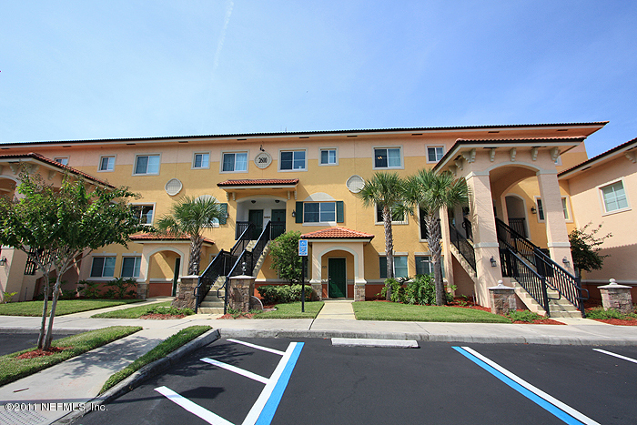 9745 Touchton Road, Unit 2625 Jacksonville, FL 32246 - Photo 2 of 18 a view of a building with a street