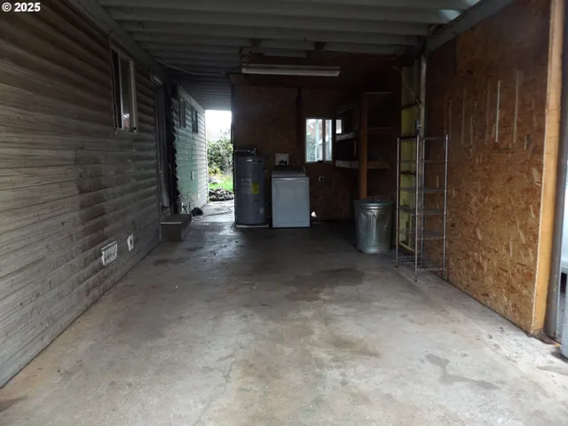 a view of an empty room with a fireplace